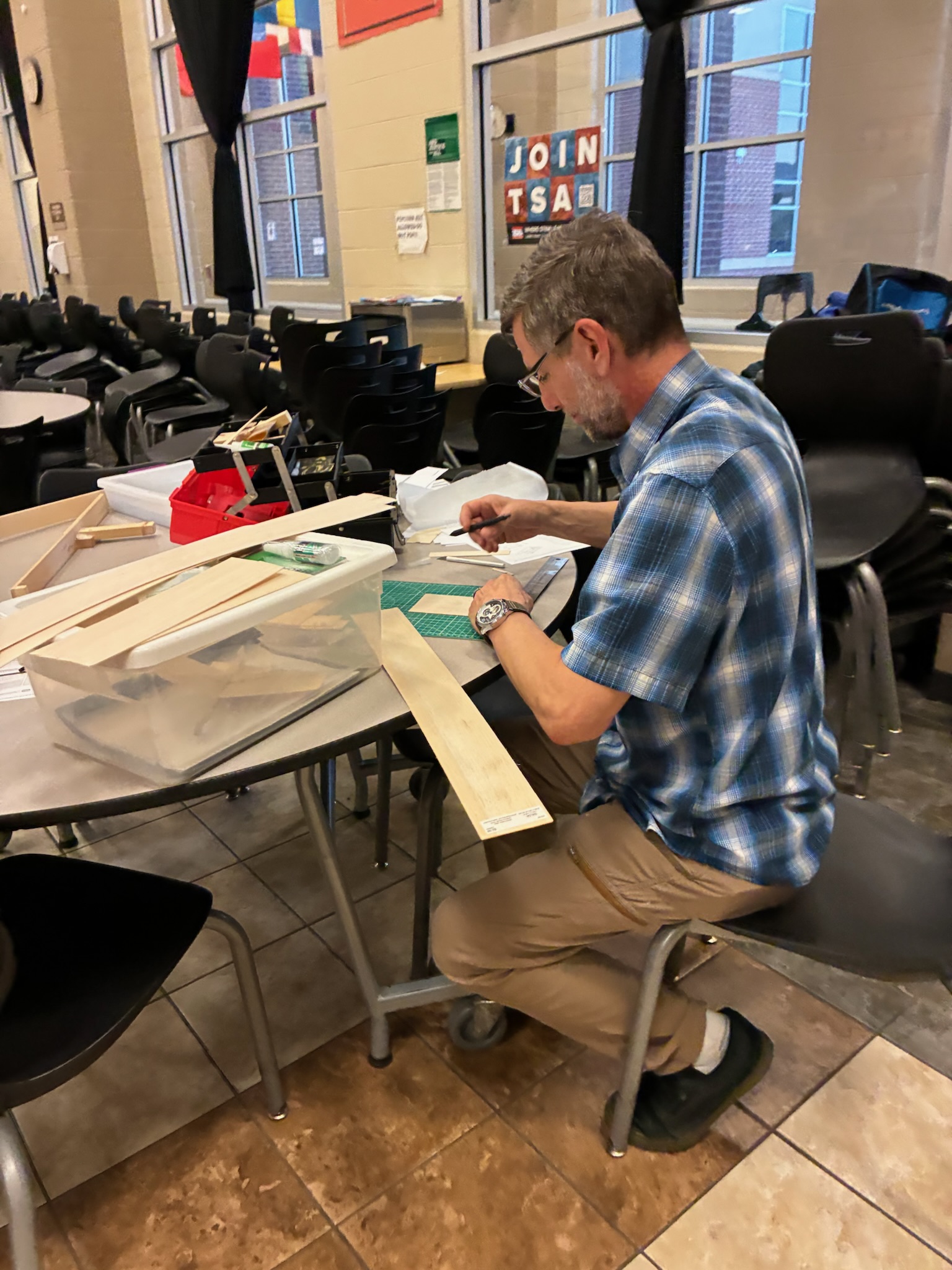 TSA member cutting balsa wood for a competition build
